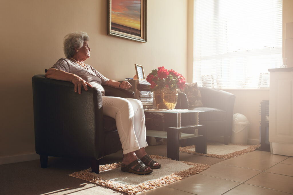 senior woman sitting in chair