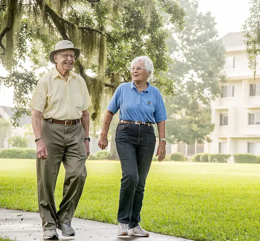 maintenance-free-cropped-2 a senior couple taking a walk outside at Santa Fe Gainesville senior community
