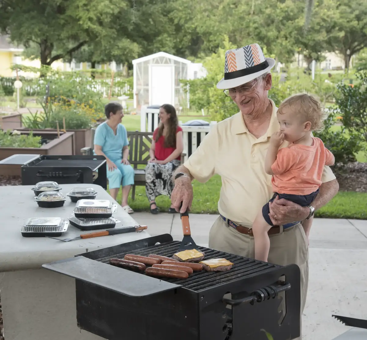 vitality-cropped-2 a senior man grilling for his family at Santa Fe Gainesville senior community